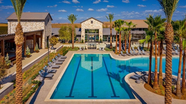 view of swimming pool with a patio