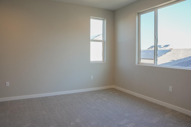 unfurnished room with carpet