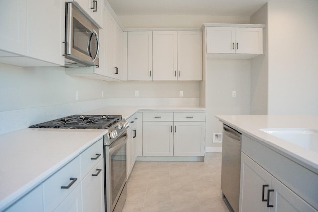 kitchen featuring white cabinetry and stainless steel appliances