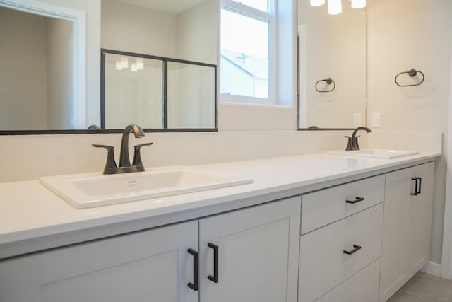 bathroom featuring vanity and tile patterned flooring