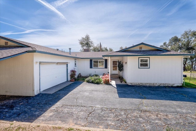 single story home featuring a garage