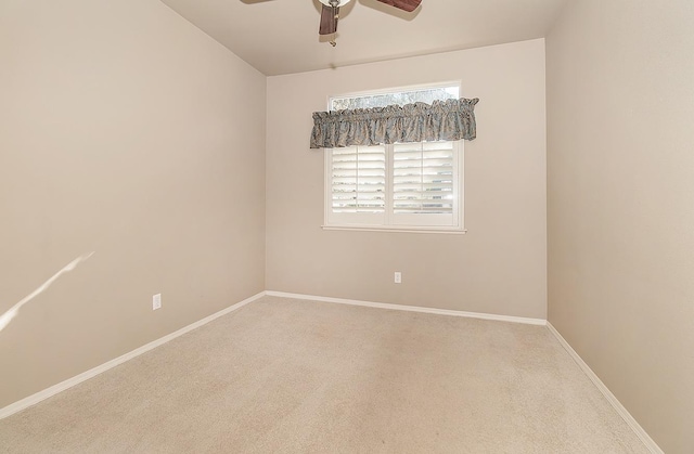 carpeted empty room with ceiling fan