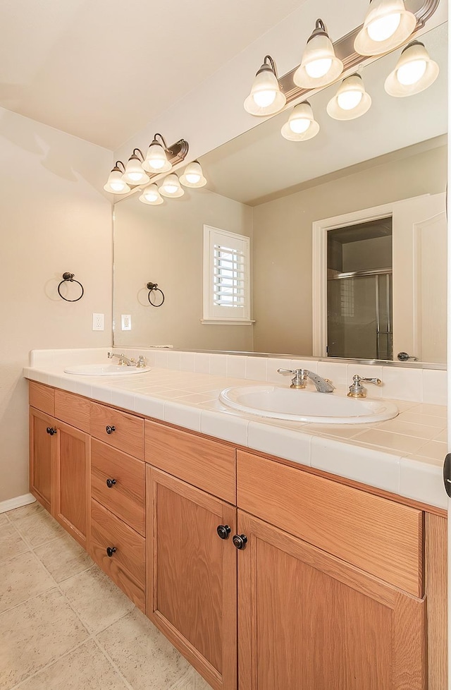 bathroom featuring vanity and walk in shower