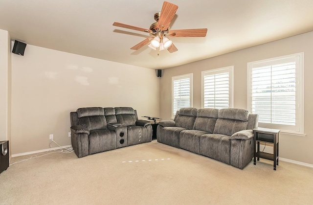 living room with light colored carpet and ceiling fan