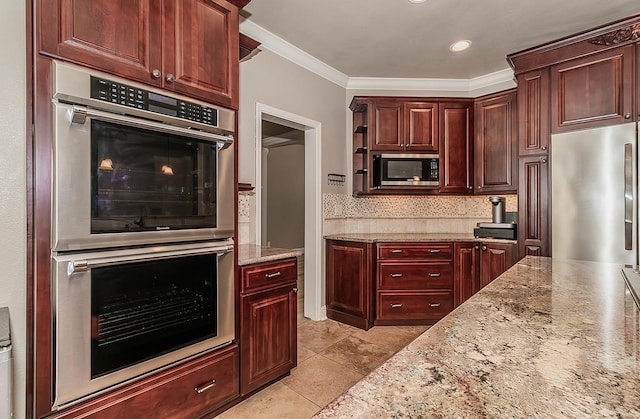 kitchen with crown molding, light stone counters, light tile patterned floors, appliances with stainless steel finishes, and decorative backsplash