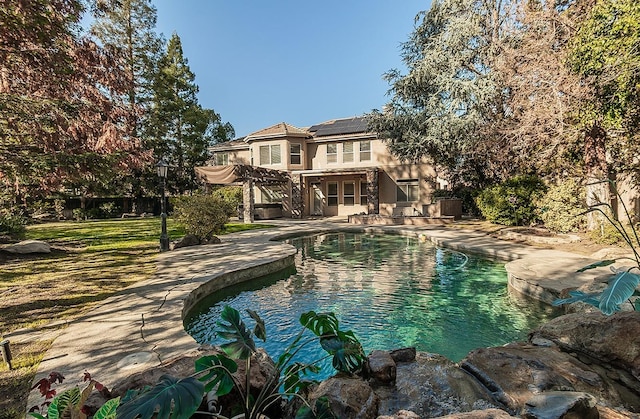 view of pool with a pergola and a patio