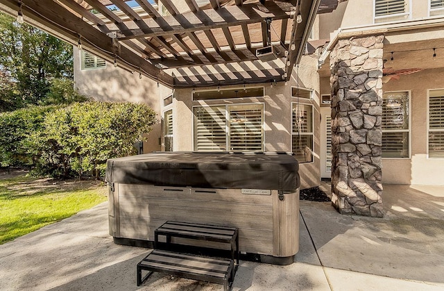 exterior details featuring a hot tub