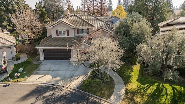 view of front of home with a garage and a front yard