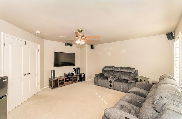 living room with ceiling fan and light colored carpet