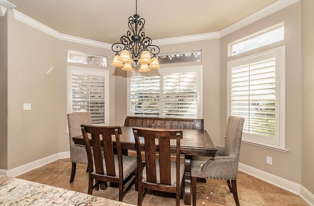 dining area featuring crown molding and an inviting chandelier