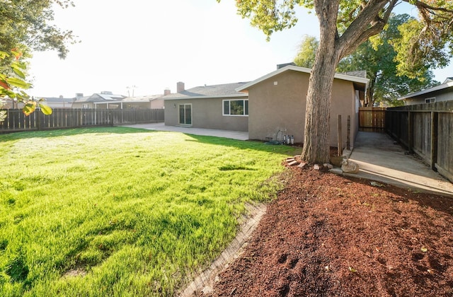 view of yard featuring a patio and a fenced backyard