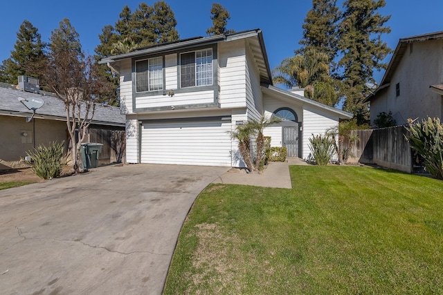 view of front of property featuring a garage and a front lawn