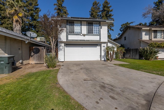 view of front of house with a garage, a front yard, and solar panels