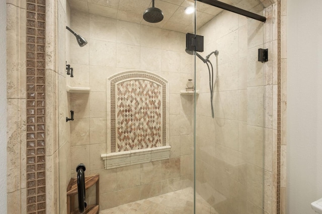 bathroom featuring a shower with shower door