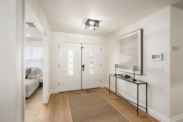 entrance foyer with light hardwood / wood-style floors