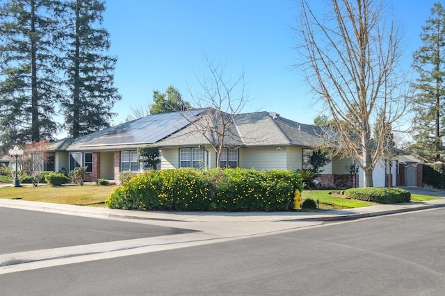 2519 24th Ave, Kingsburg, CA 93631 - single story home featuring brick siding, a front yard, a garage, and concrete driveway