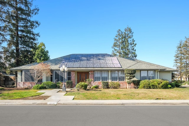 ranch-style home featuring a front yard