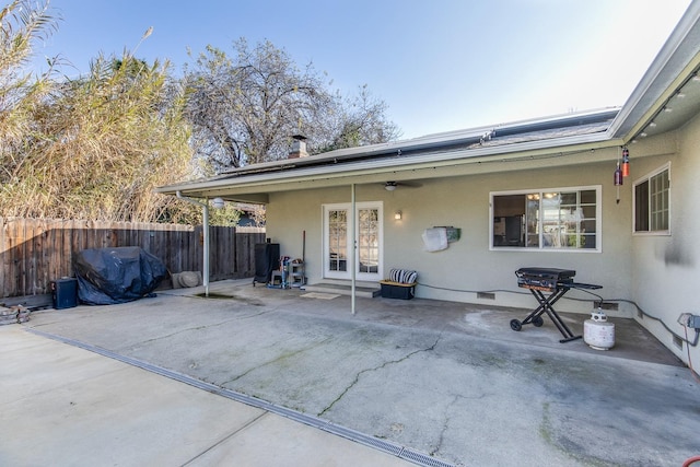 back of property featuring ceiling fan, fence, french doors, a patio area, and stucco siding