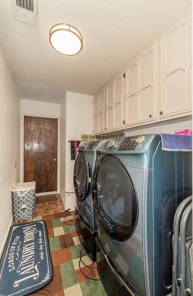 6779 N Woodson Ave, Fresno, CA 93711 - washroom featuring cabinet space, washing machine and clothes dryer, and a textured ceiling