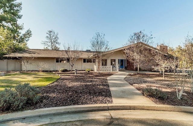 ranch-style home with a front yard