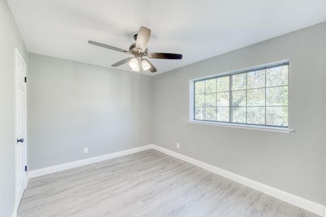 unfurnished room featuring ceiling fan and light hardwood / wood-style flooring