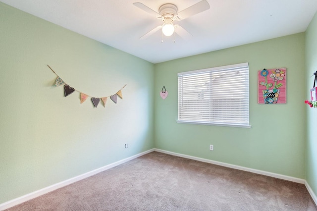 unfurnished room featuring carpet floors and ceiling fan