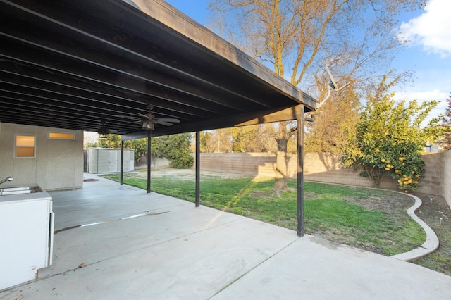 view of patio / terrace with a shed