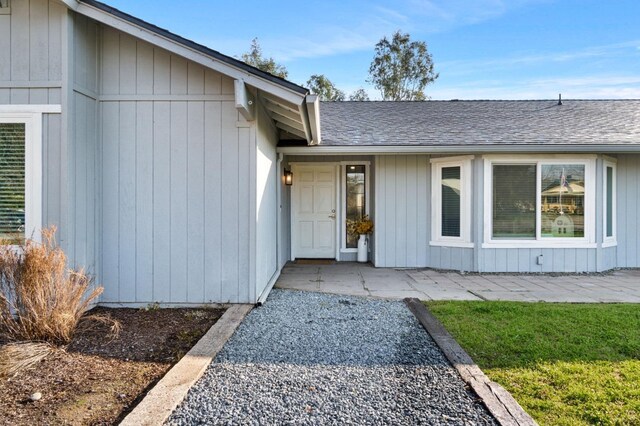 doorway to property with a patio area