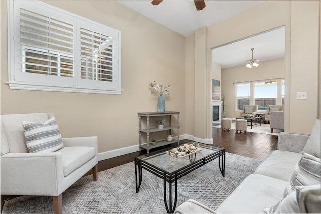 living room with hardwood / wood-style flooring and ceiling fan