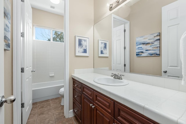 full bathroom featuring tile patterned flooring, vanity, washtub / shower combination, and toilet