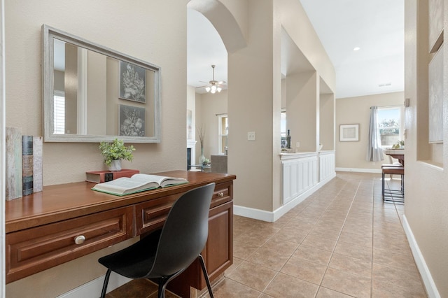 office space with ceiling fan and light tile patterned flooring