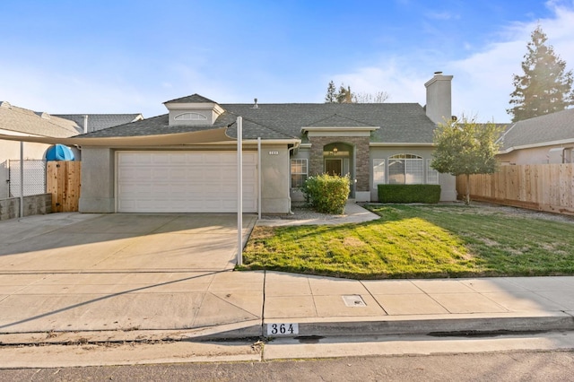 ranch-style home with a garage and a front yard