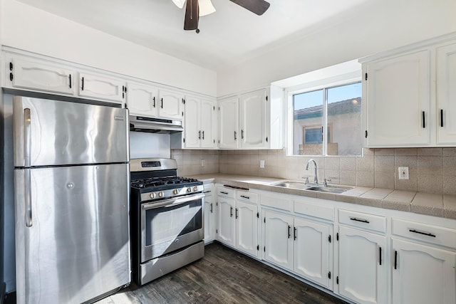 kitchen with stainless steel appliances and white cabinets