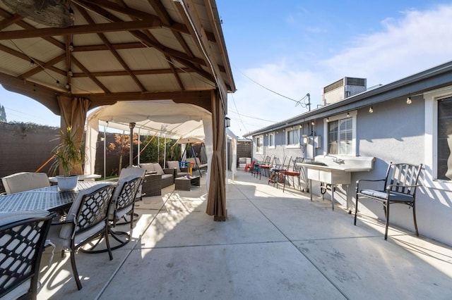 view of patio / terrace featuring a gazebo and an outdoor hangout area