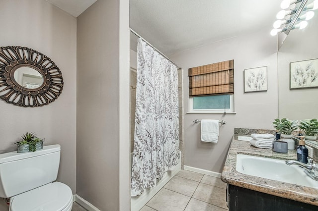 bathroom with toilet, a shower with curtain, tile patterned flooring, and baseboards