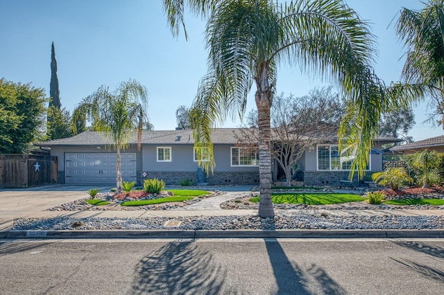 single story home with driveway, a garage, brick siding, fence, and stucco siding