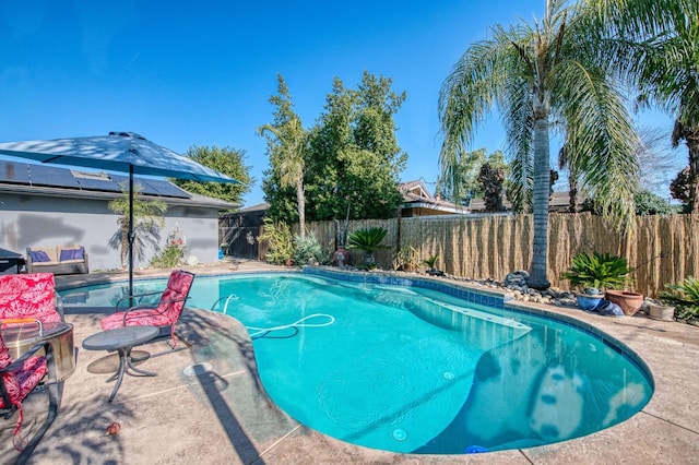 view of pool with a fenced in pool, a fenced backyard, and a patio