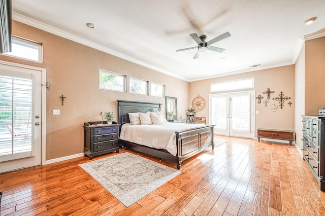 bedroom with access to exterior, multiple windows, ornamental molding, and light wood-style flooring