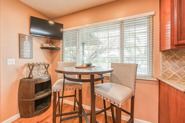 dining room with wood finished floors and baseboards