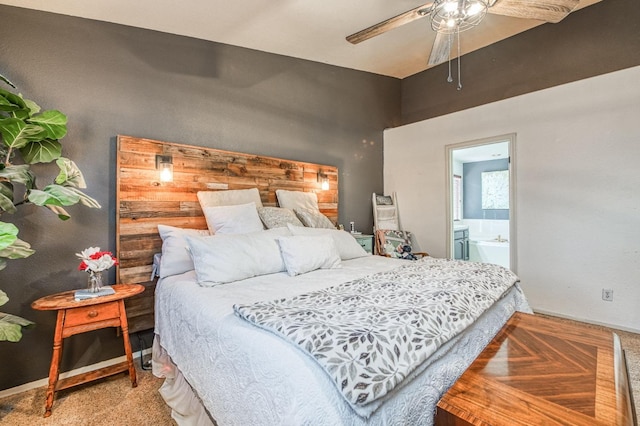 carpeted bedroom featuring baseboards, a ceiling fan, and connected bathroom