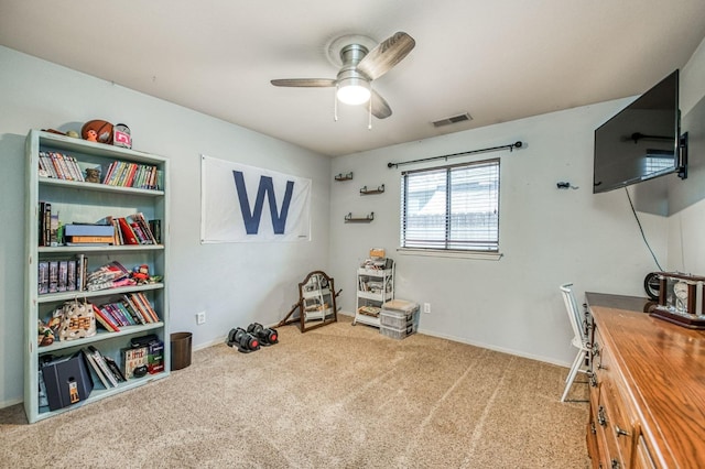 interior space featuring carpet, visible vents, ceiling fan, and baseboards