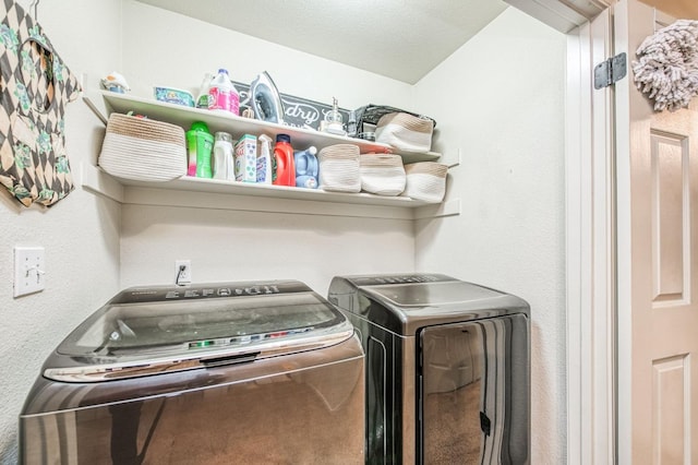 clothes washing area with laundry area and washing machine and clothes dryer