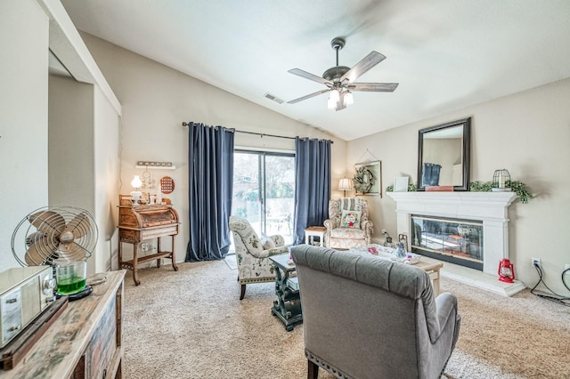 living room with lofted ceiling, ceiling fan, visible vents, and light colored carpet