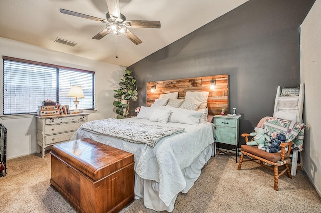 bedroom with vaulted ceiling, ceiling fan, light carpet, and visible vents