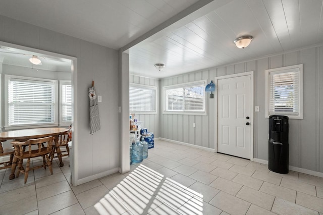 tiled entryway with plenty of natural light