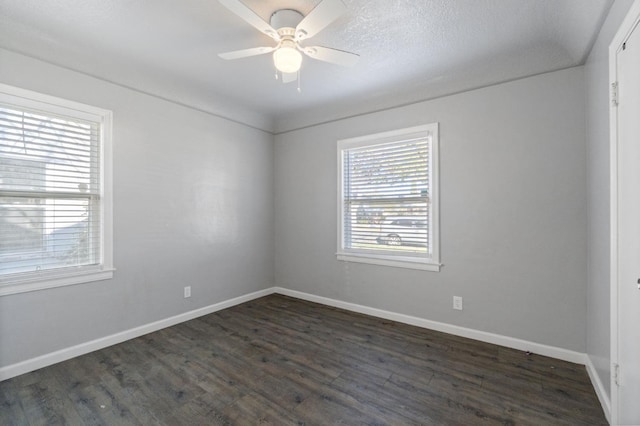 unfurnished room featuring ceiling fan, dark hardwood / wood-style floors, and a textured ceiling