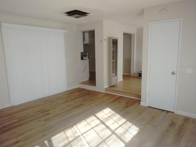 empty room featuring light hardwood / wood-style floors