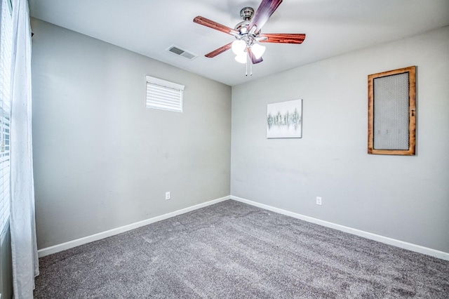 carpeted empty room featuring ceiling fan