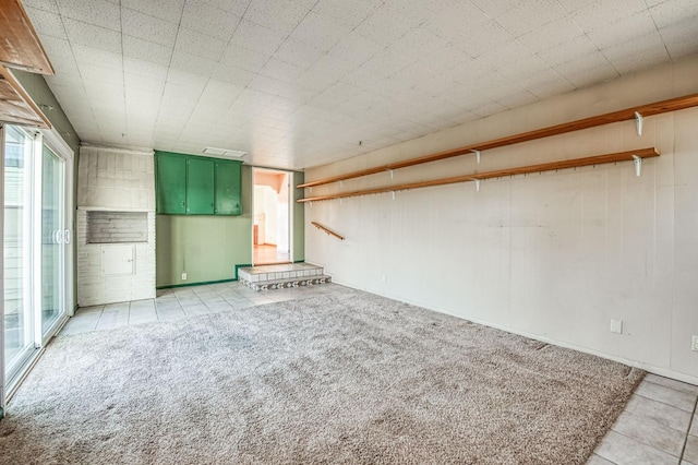 unfurnished living room with light colored carpet