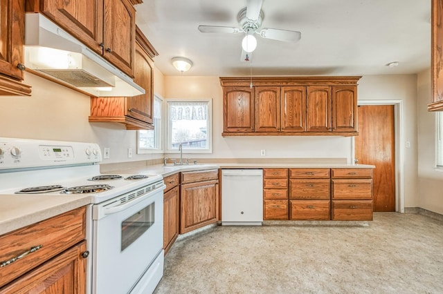 kitchen featuring sink, white appliances, and ceiling fan